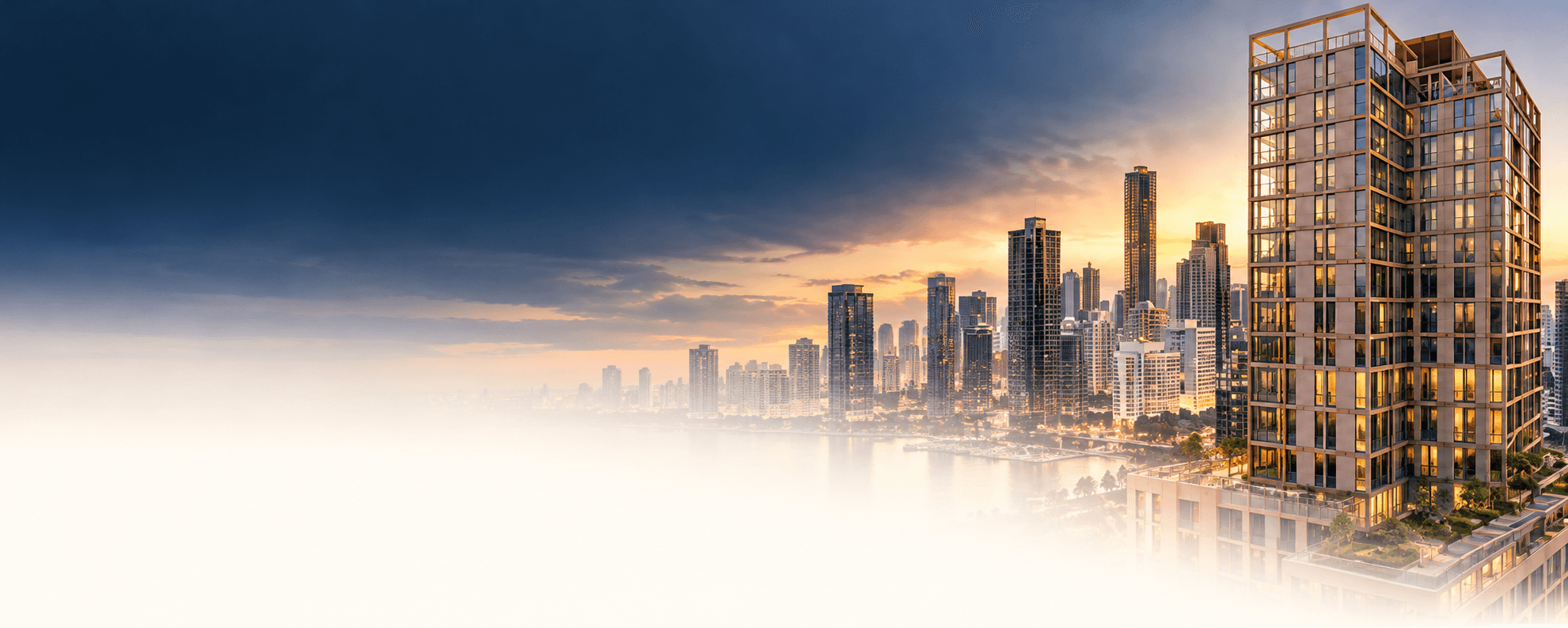 Glass residential tower and city skyline at dusk