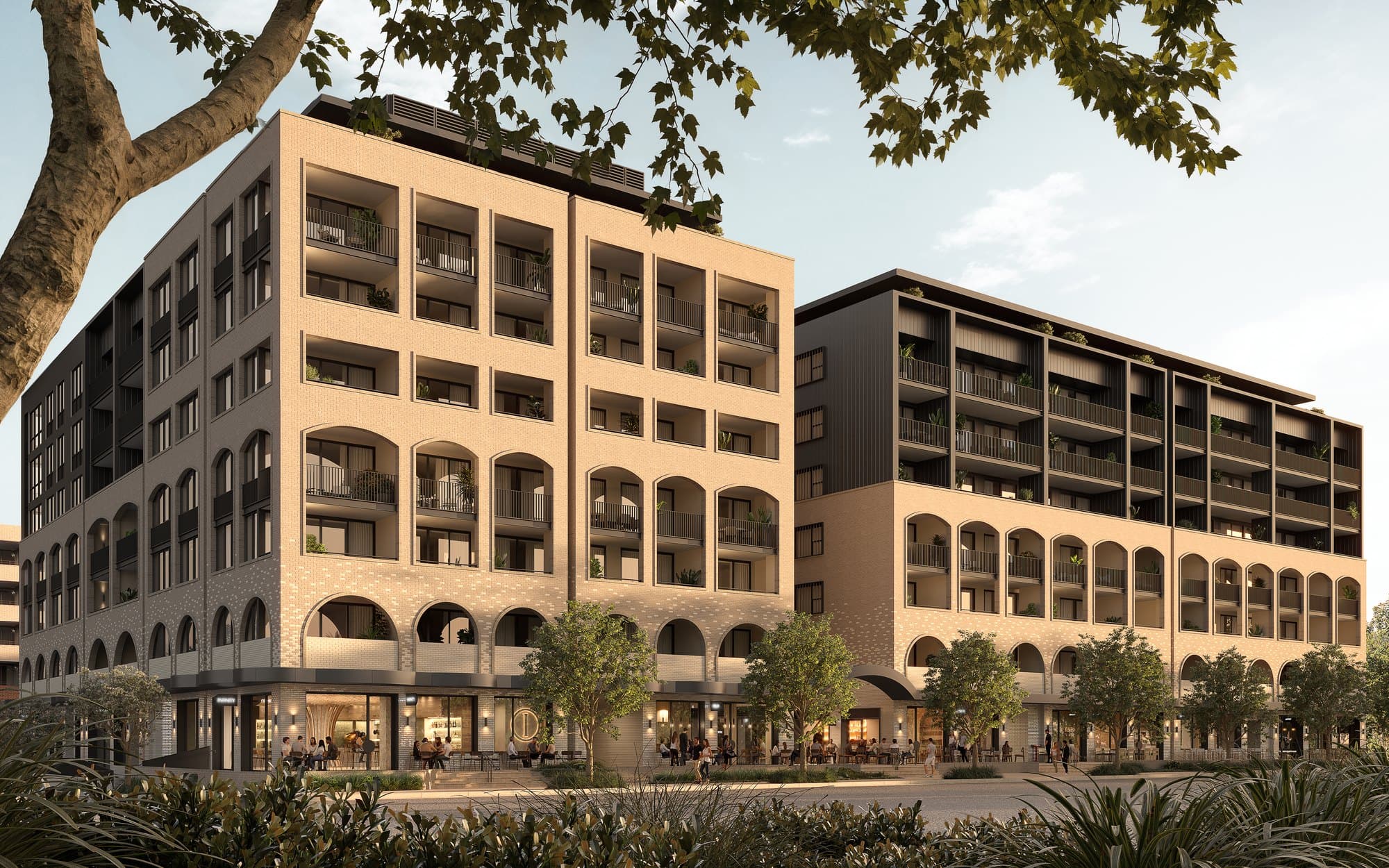 Brick apartment building with arched balconies at Newmarket Stage 3